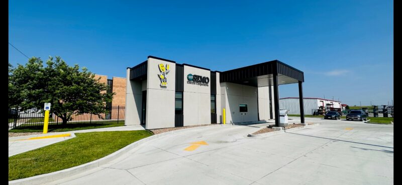 New Sikeston office building with drive thru. SEMO logo and image of Willie Wirehand on side of building.